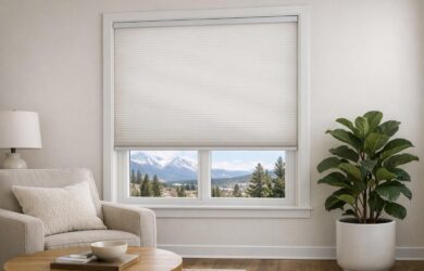 Stock photo showing a modern Colorado home interior with cordless cellular shades on the window, securely installed to highlight child safety features, and no visible cords or people.